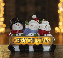 Load image into Gallery viewer, VP Home Glowing Merry Christmas Sign Trio LED Snowman Decor Christmas Figurines Resin Lighted Snowman Decorations Holiday Light up Snowman Indoor Festive Fiber Optic Decorations